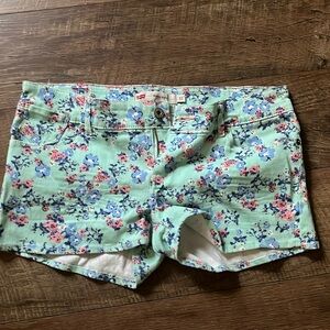 Levi’s shorty short Size 11 Teal with light blue and pink flowers
